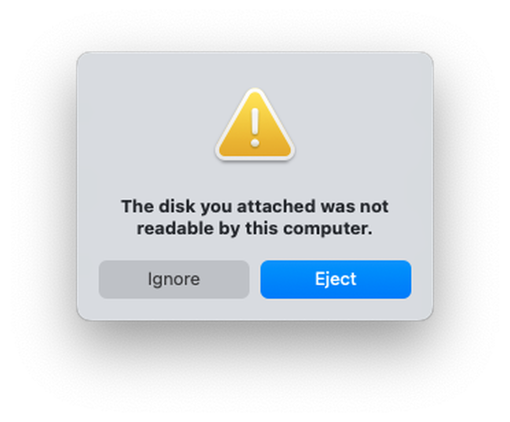 macOS dialog: The disk you inserted was not readable by this computer.