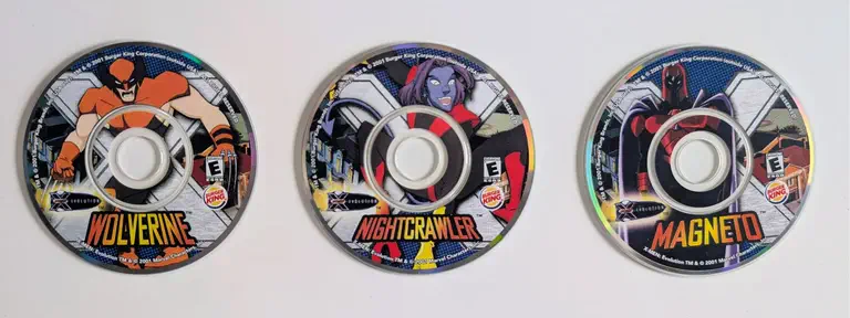 Three Burger King X-Men Evolution promotional mini CDs: Wolverine, Nightcrawler, and Magneto.